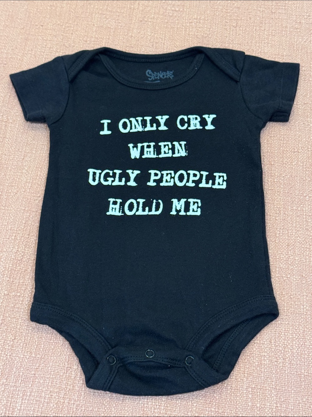 100% cotton Black Onesie with “ I only cry when ugly people hold me “ text